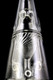 Macro close-up of fluted inner funnel and dual uptakes on clear recycler glass—retail smoke-shop detail for Peak buyers.