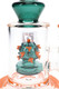 Close-up of the teal virus-shaped showerhead perc with raised orange accents inside the clear chamber.