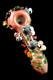 Top-down forest-theme glass spoon for head-shop buyers, 4.5" borosilicate in log brown with vines, owls, ladybug, and mushrooms, glossy black angle.