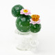 Full product on white for head-shop supplies—6" US-made cactus mini rig with 14.5 mm female joint and amber cup mouthpiece, front three-quarter view.