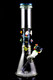 Black-background studio shot of 14" US-made beaker bong with galaxy neck, planets, rocket and astronaut accents; wholesale glass water pipe, front angle.