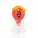 Red glass bubble cap with yellow drip crown and cartoon face, wholesale head-shop accessory, front view on white atop a clear quartz banger.