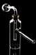 US-made 4" clear glass bottle oil burner bubbler rig, angled view showing downstem and side tube; ideal for retail smoke gear assortments.
