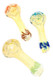 Assorted small fumed color-changing glass spoon pipes with translucent golden finish, textured frit interior, rounded bowls, and colorful worked glass accents.
