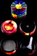 Psychedelic apple variant zinc-alloy 4-part grinder on black backdrop, screen and scraper visible; wholesale accessory photo.