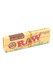 RAW Organic Connoisseur 1 ¼ booklet with tips for head-shop retail, kraft-tan pack with elastic band and vegan gum callout, angled view. RAW Organic Connoisseur 1 ¼ booklet with tips for head-shop retail, kraft-tan pack with elastic band and vegan gum callout, angled view.