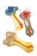 Three 5.5" thick color-changing fumed frit rasta glass spoon pipes with marble accents; wholesale head-shop photo, top-down view.