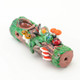 Textured mossy log glass hand pipe with green accents and tiny mushrooms; 4" borosilicate novelty for wholesale head-shop buyers, front three-quarter view.