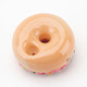 Underside of donut pipe showing carb hole and mouth opening in tan base; compact borosilicate novelty for B2B head-shop product pages.