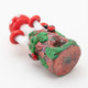 Rear view of toadstool pipe highlighting textured base, vines, and ladybug details; B2B showcase glass, close studio angle.