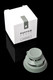 Flourish green Proxy Joystick Cap beside white Puffco retail box on black; shelf-ready packaging emphasized for wholesale buyers.