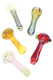 Wholesale mixed 4-inch glass spoon pipes in assorted swirl and ribbon designs, clear borosilicate trio, front angled showcase view, 90 g pieces.