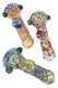 Three 5" confetti frit color-changing glass spoons with floral marbles and green bowl nubs; assorted designs for head-shop wholesale, top-down view. Three 5" confetti frit color-changing glass spoons with floral marbles and green bowl nubs; assorted designs for head-shop wholesale, top-down view.