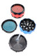 Red and blue 2" hypnotic design aluminum metal herb grinder shown in three parts with mesh screen and scraper for smoke shop wholesale buyers.