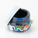 Open Across the Universe glass terp jar for wholesale dab accessories, showing lid and dark interior