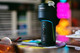 Dr. Dabber Switch GO on a tabletop with black body, blue accent lighting, glass top, and USB-C port