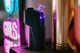 Rear lifestyle view of Dr. Dabber Switch GO with glass attachment and purple chamber lighting