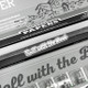 Close-up of open HEMPER combo pack showing rolling paper compartment and clear glass tips below