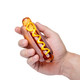 Glizzy hot dog glass hand pipe held in hand, showing amber glass, frosted bun and yellow mustard swirl