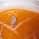 Detail view of question mark decoration on orange waffle-textured body of ice cream cone glass hand pipe