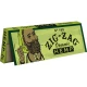 Zig-Zag Organic Hemp 1 1/4 rolling paper pack in green packaging with illustrated bearded character