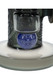 Close-up of blue hieroglyphic-style marble accent beneath the bowl joint on frosted glass water pipe