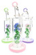 Three 6B Glass water pipes with sculpted rose percs, green leaves, and pink, green, and purple base accents.
