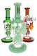 Three 6B Glass dab rigs with mint green, green and amber accents, sculpted vine leaf percs and clear chambers.