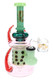 6B Glass dab rig with green neck, dotted inner section, pink body, red spiral-patterned spikes, and clear banger.