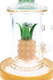 Close-up of the textured yellow pineapple perc with green glass leaves inside the clear water pipe chamber.