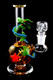 Amber sphere-body mini rig with green dragon wrap and 14.5 mm female joint on black—premium wholesale concentrate rig, 6.5" clear borosilicate.