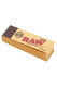 Wholesale RAW Original Tips pack, natural brown paper, 50 tips per pack, angled view on white with dark spine branding. Wholesale RAW Original Tips pack, natural brown paper, 50 tips per pack, angled view on white with dark spine branding.