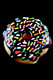 Close-up of chocolate-glazed donut spoon with multicolor sprinkles on black background; compact novelty hand pipe for wholesale catalogs.