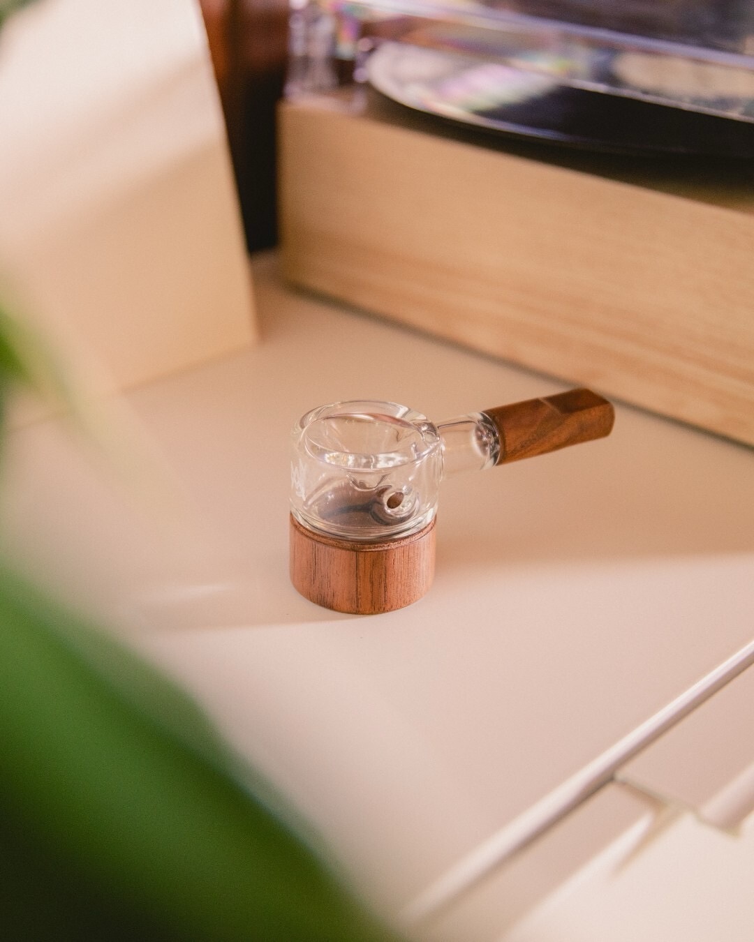 Granby Hand Pipe with clear borosilicate bowl and subtle walnut detail, compact palm-sized profile, vertical photo
