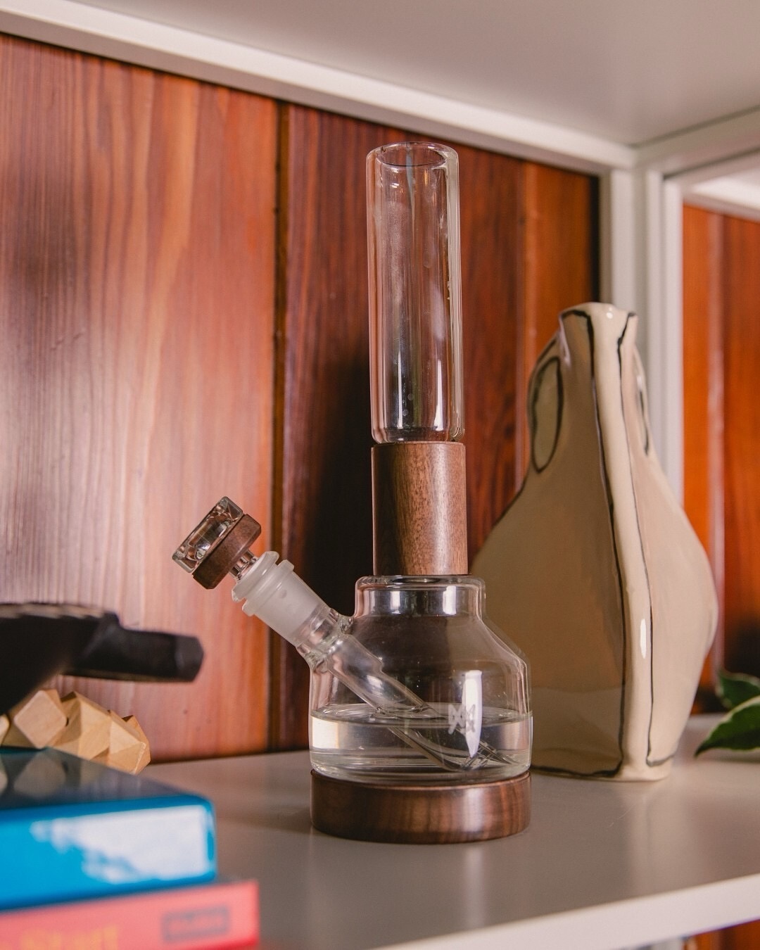 Palisade Water Pipe with minimalist borosilicate body and black walnut accents from MJ Arsenal Alpine Collection, vertical angle