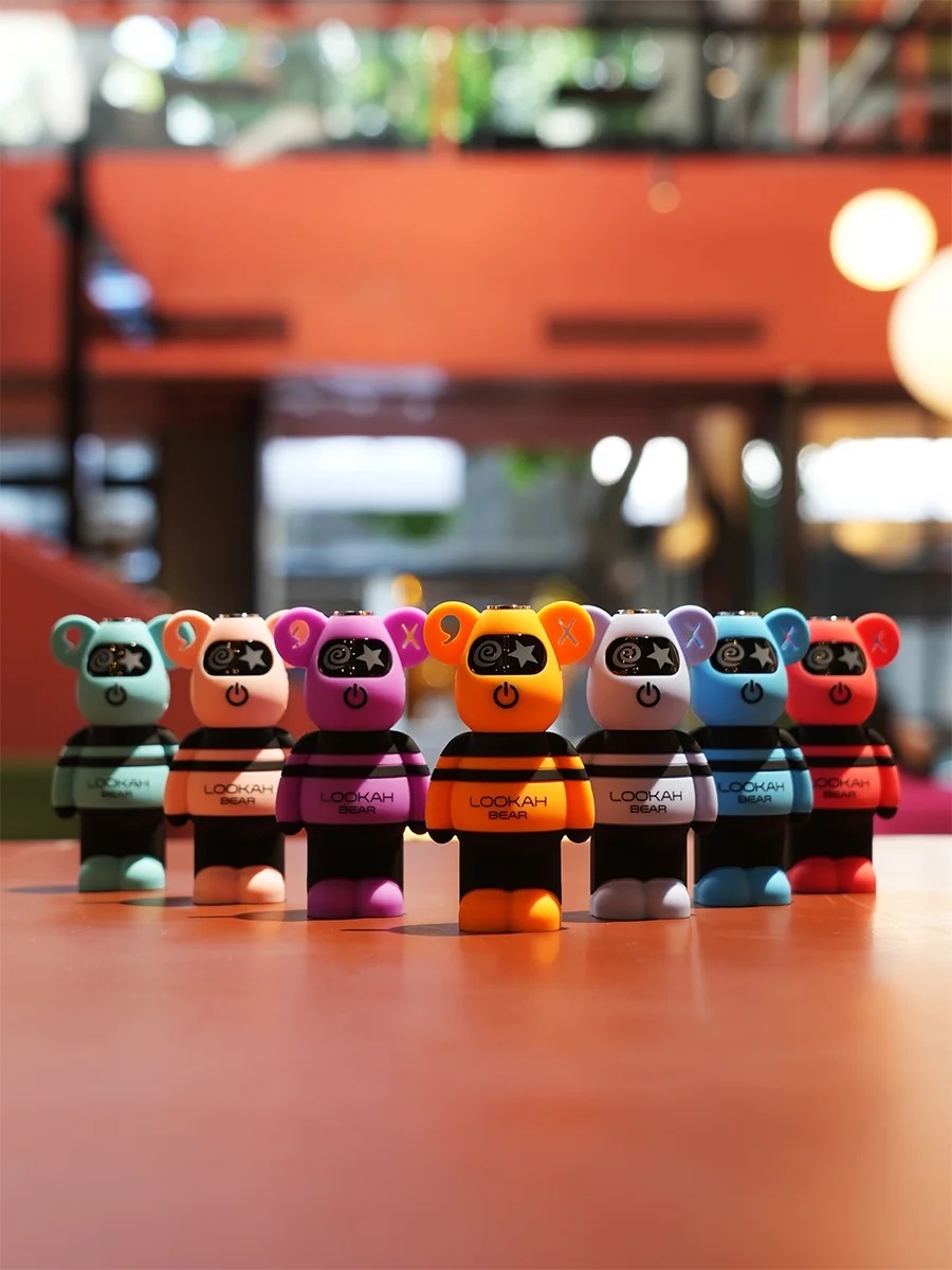 Lookah Bear 510 batteries in a rainbow of colors standing in a row with silicone toy-style bodies