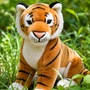 Auswella Plush Kenya realistic tiger stuffed animal with orange and black stripes, white chest and paws, posed outdoors in a lush jungle-inspired setting