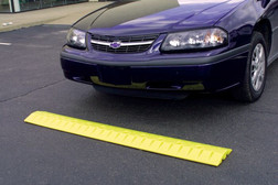 Justrite 1792 High Density Polyethylene Yellow 2-Channel Speed Bump Cable Protector - Each