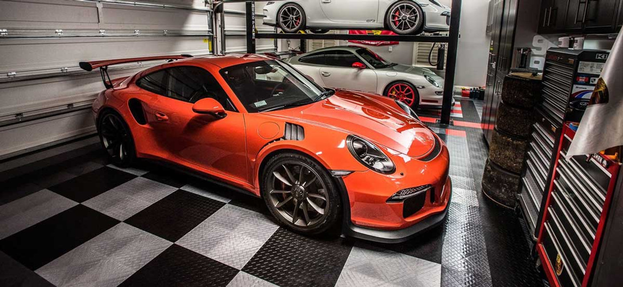 Racedeck garage flooring with orange Porche parked