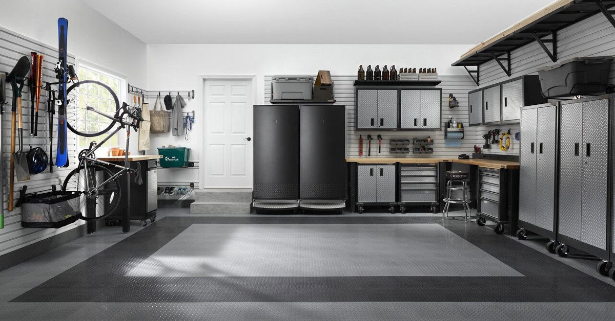 Garage organized with Gladiator Appliances, Workbench, and Cabinets