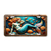 Vibrant Mermaid license plate featuring red-haired mermaid with turquoise scales, seashells, coral, and golden fish in embossed-look design.