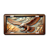 Embossed metal eagle license plate featuring an eagle soaring across mountains in copper and steel relief-style artwork.