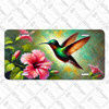 Hummingbird license plate featuring oil-painting style artwork with a green hummingbird and pink hibiscus flowers. Hummingbird license plate featuring oil-painting style artwork with a green hummingbird and pink hibiscus flowers.