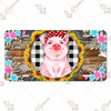 Pig license plate featuring rustic farmhouse design with sunflower wreath, buffalo plaid, and floral accents in distressed wood background on aluminum.