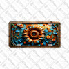 Rustic sunflower floral license plate featuring bold orange bloom with teal leaves and smaller blossoms in embossed-look artwork on aluminum.