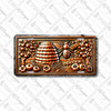 Rustic beehive and honeybee license plate featuring embossed-look copper design with hive, flowers, and fruit tree branches on aluminum plate.
