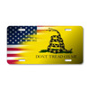 American and Gadsden flag license plate featuring bold red, white, blue, and yellow design with coiled rattlesnake and “Don’t Tread on Me” text in embossed-look artwork on aluminum.