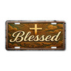 Blessed with Cross license plate featuring golden script lettering with radiant cross and glowing beams over rustic cloud backdrop in embossed-look artwork on aluminum