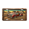 Farm truck license plate featuring a vintage red pickup truck in front of a barn and silo with golden wheat fields at sunset, rustic embossed-look artwork on aluminum.