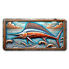 Marlin license plate featuring embossed-look copper and blue marlin leaping among curling waves under dramatic sky.